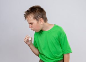 ill-little-boy-green-t-shirt-feeling-unwell-coughing-standing-white-wall-1-768×560-1