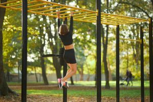 woman-crossing-horizontal-bar-during-outdoors-activity_7502-7816