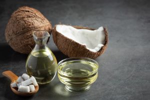 jug-coconut-oil-whit-coconut-put-dark-background_1150-28252