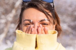portrait-young-woman-winter-forest-sunny-day-with-snow-white-smile-fooling-around_343596-4558